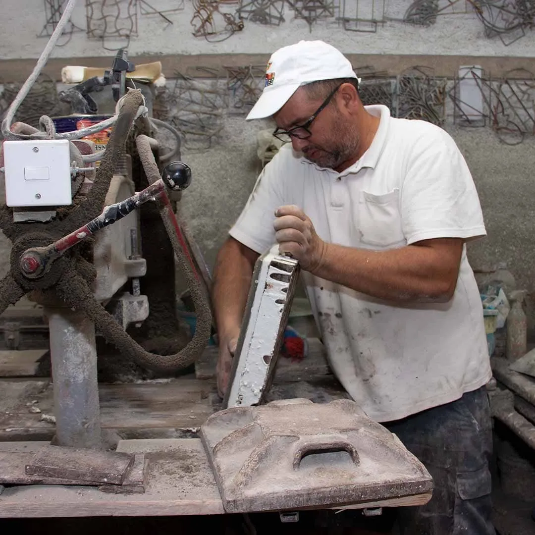 Robert Lia working at one of the original tile presses in the Malta Tiles workshop