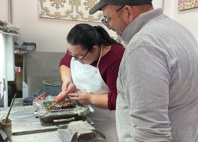 A maker guiding a participant through the process